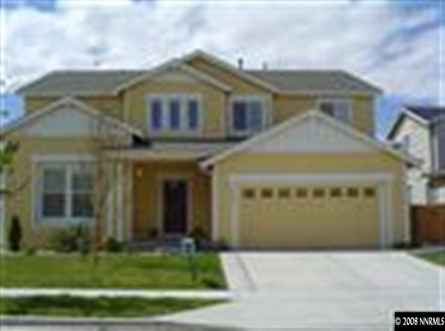 8983 Mahon Drive Reno, NV 89506 - Photo 1 of 8 a front view of a house with a yard