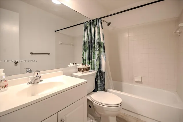 a bathroom with a sink a toilet and a bathtub