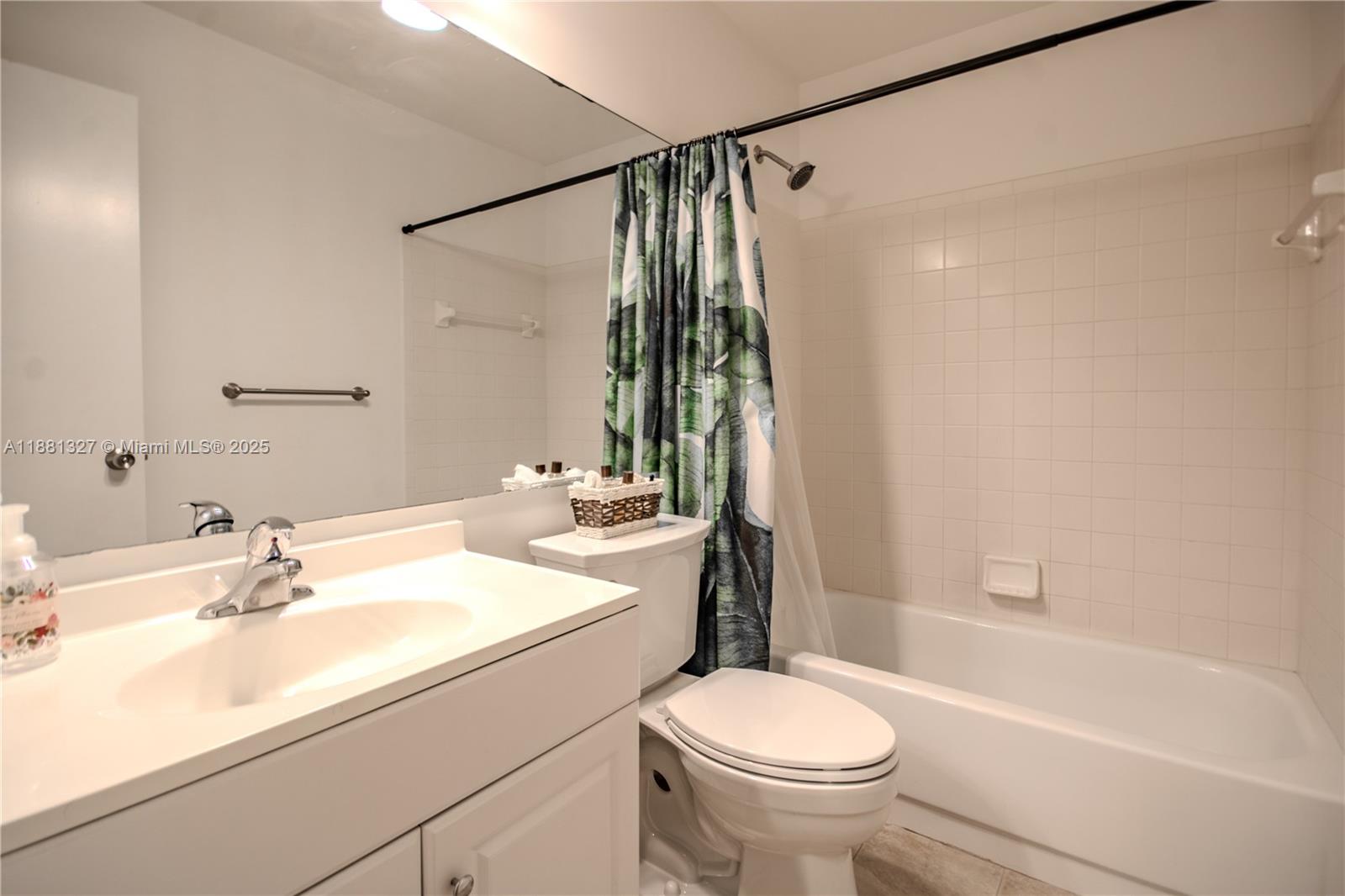 7652 Pinewalk Drive South, Unit 139 Margate, FL 33063 - Photo 11 of 26 a bathroom with a sink a toilet and a bathtub