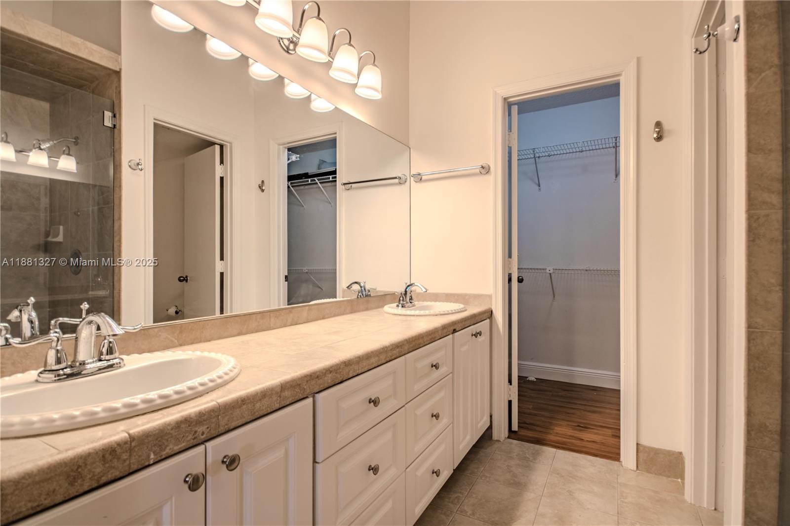 7652 Pinewalk Drive South, Unit 139 Margate, FL 33063 - Photo 17 of 26 a bathroom with a granite countertop sink mirror and double