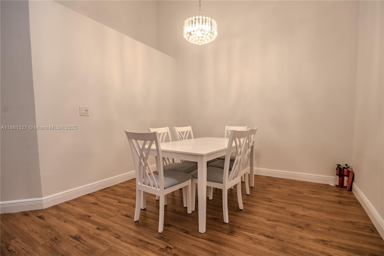 7652 Pinewalk Drive South, Unit 139 Margate, FL 33063 - Photo 5 of 26 a view of a dining room with furniture and wooden floor
