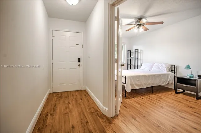 a bedroom with a bed and a table