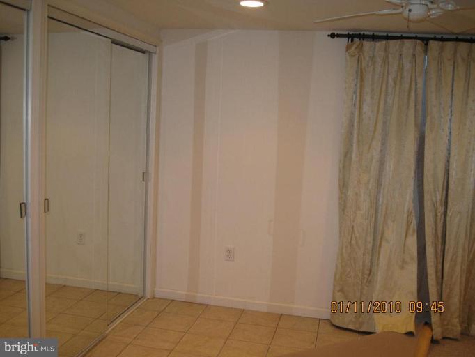 7301 Loisdale Road Springfield, VA 22150 - Photo 18 of 19 Lower Level Den with tile floor & closets