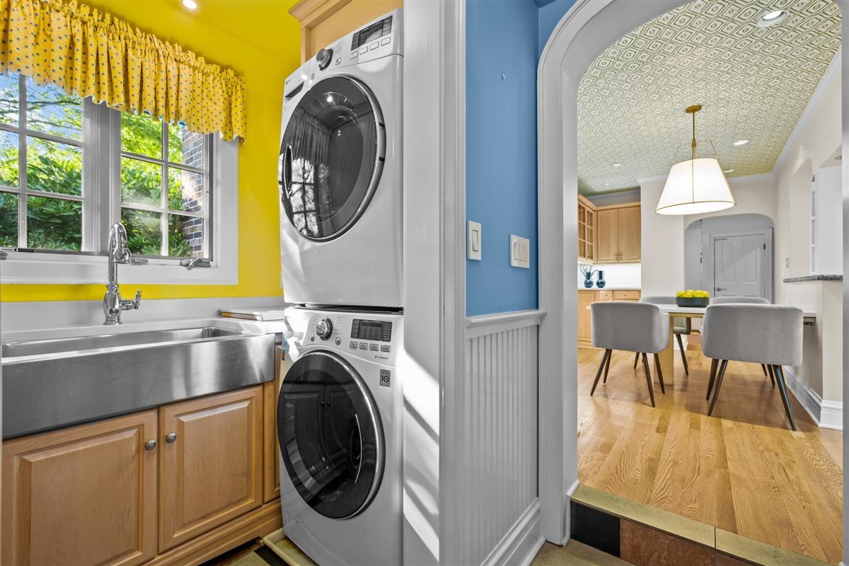 299 Vernon Avenue Glencoe, IL 60022 - Photo 16 of 42 a view of a hallway with washer and dryer