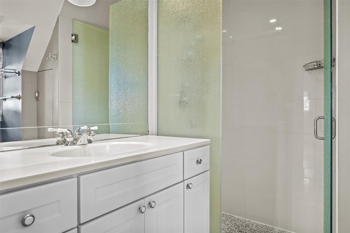 299 Vernon Avenue Glencoe, IL 60022 - Photo 26 of 42 a bathroom with a sink and a mirror