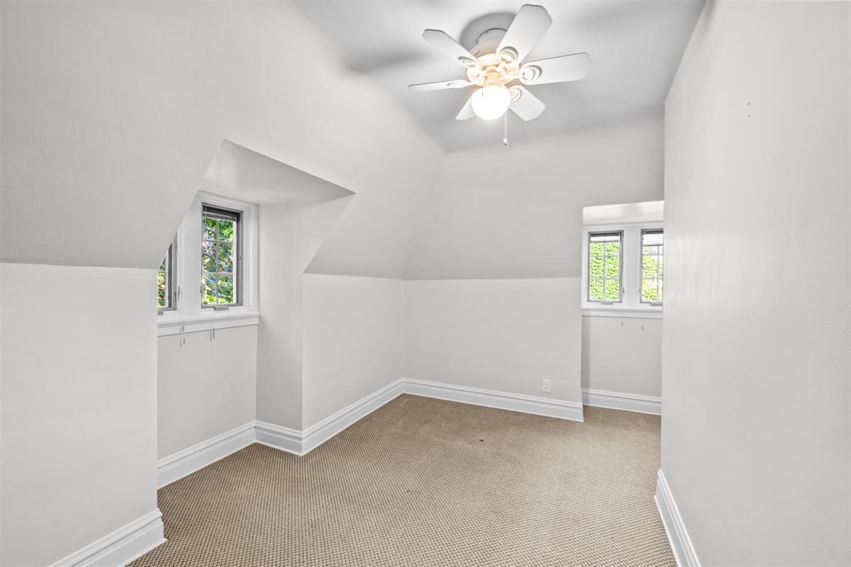 299 Vernon Avenue Glencoe, IL 60022 - Photo 28 of 42 an empty room with a window and a fan