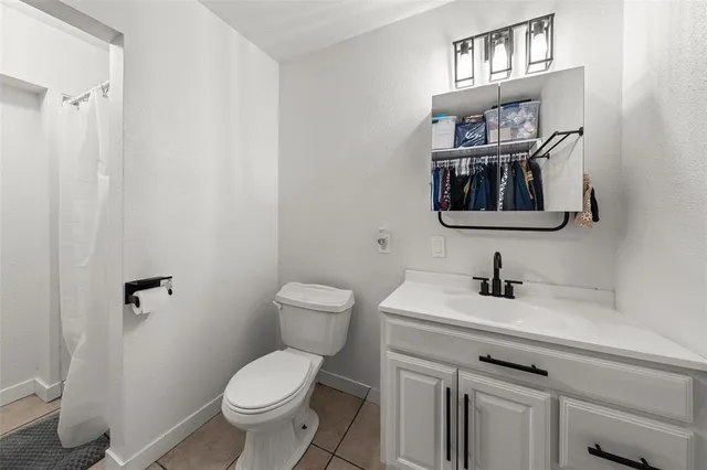 a room with cabinets and wooden floor