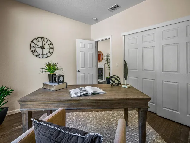 a dining room with a table and chairs