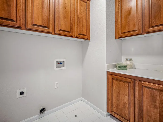 a bathroom with a sink and cabinets