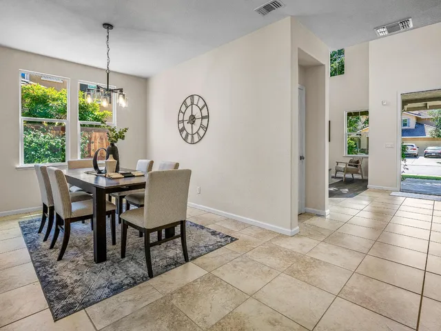 a dining room with furniture and window