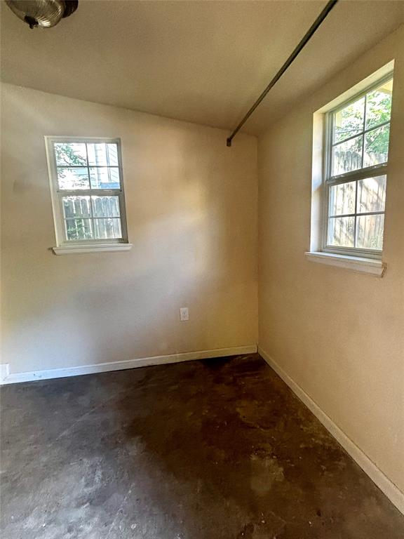 905 Isbell Road Fort Worth, TX 76114 - Photo 26 of 30 an empty room with a window
