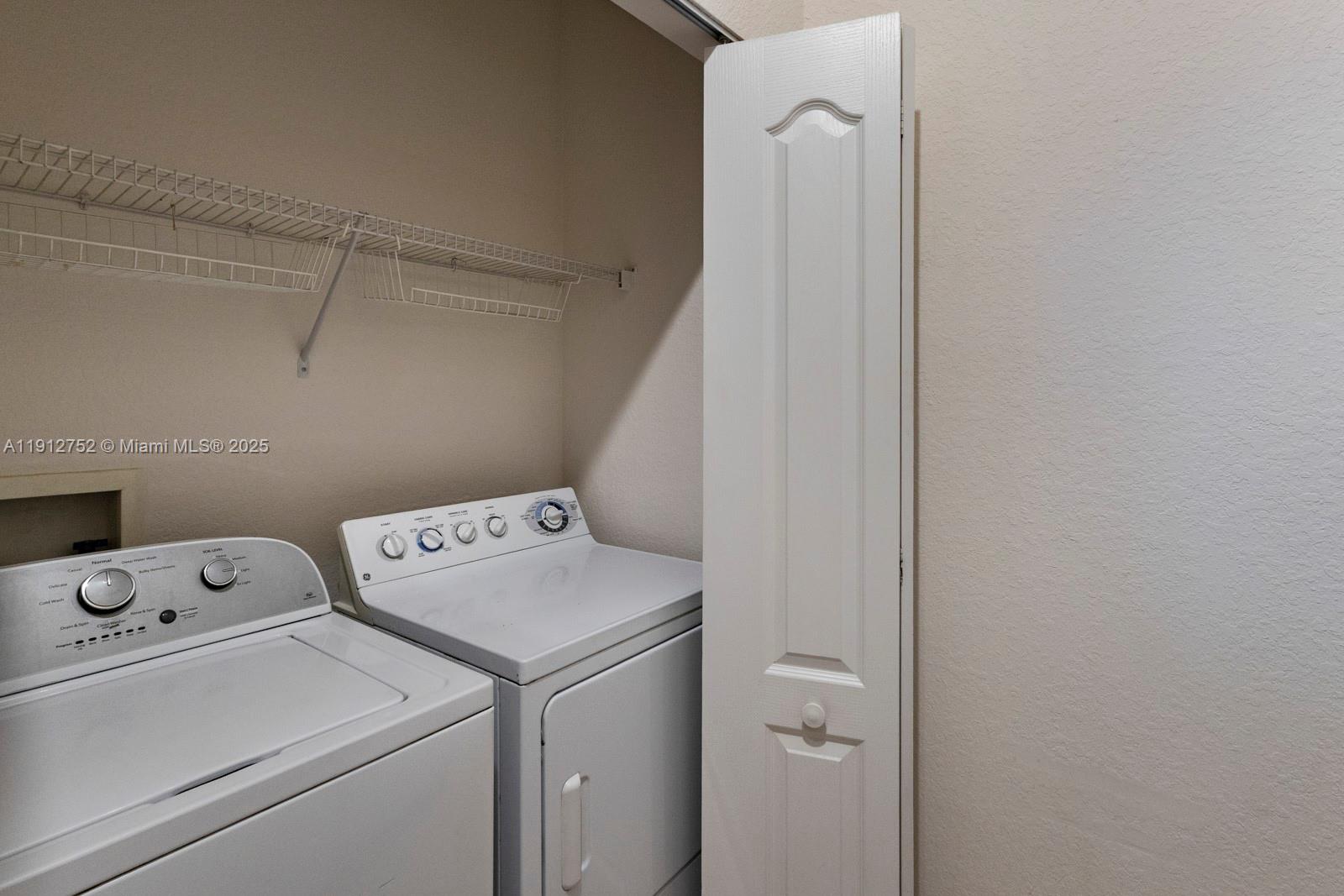 6001 Southwest 70th Street, Unit 139 South Miami, FL 33143 - Photo 15 of 29 a utility room with dryer and washer