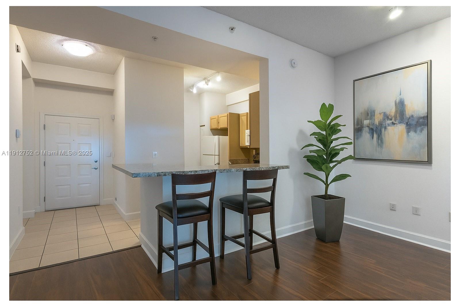 6001 Southwest 70th Street, Unit 139 South Miami, FL 33143 - Photo 2 of 29 a view of a hallway and dining room