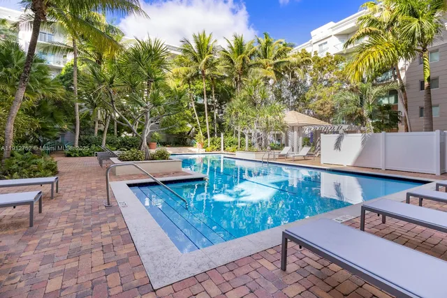 a view of a patio with table and chairs and potted plants