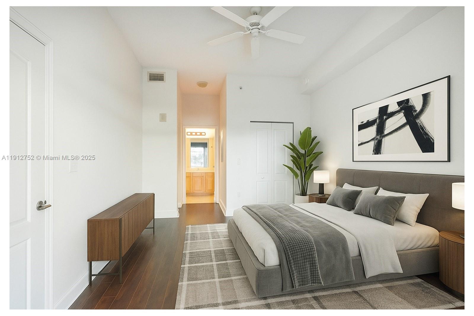 6001 Southwest 70th Street, Unit 139 South Miami, FL 33143 - Photo 4 of 29 a bedroom with a bed and a painting on the wall