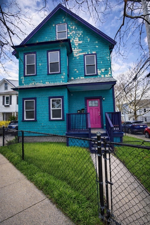 67 Prospect Street Somerville, MA 02143 - Photo 1 of 11 a front view of a house with a yard