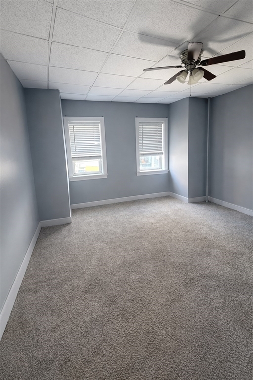 67 Prospect Street Somerville, MA 02143 - Photo 10 of 11 a view of a livingroom with a ceiling fan and window