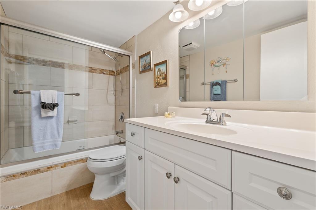 5500 Bonita Beach Road Southwest, Unit 208 Bonita Springs, FL 34134 - Photo 14 of 14 a bathroom with a sink toilet vanity and shower