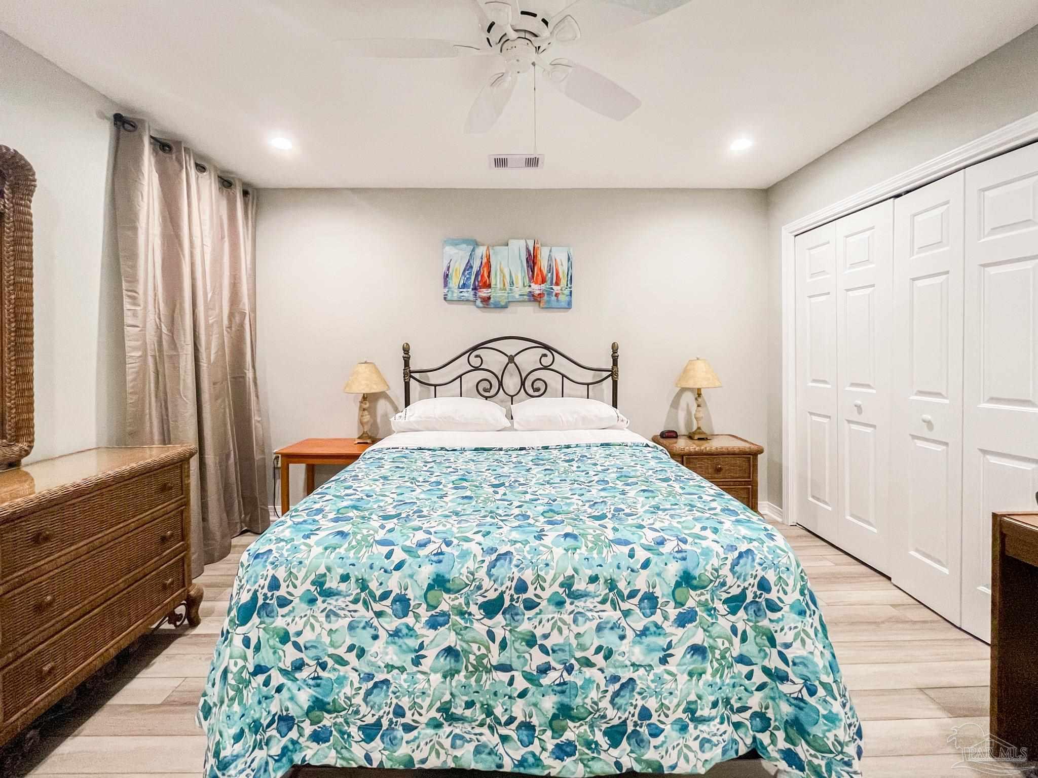 13351 Johnson Beach Road, Unit 402E Pensacola, FL 32507 - Photo 25 of 30 a bedroom with a bed and a window