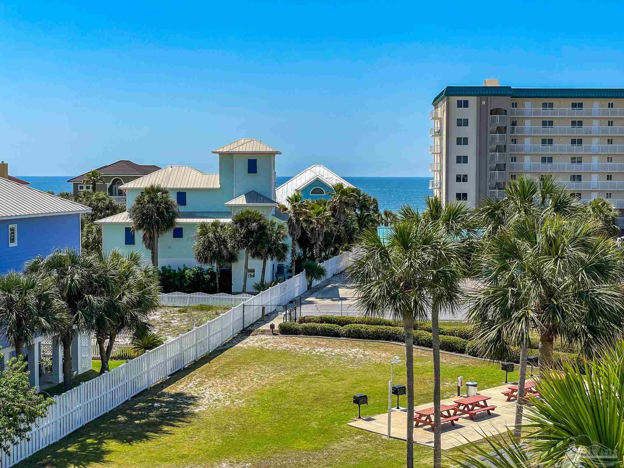 13351 Johnson Beach Road, Unit 402E Pensacola, FL 32507 - Photo 28 of 30 a view of a building with a swimming pool