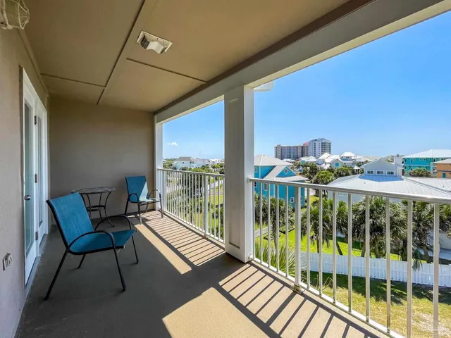 a view of a balcony with furniture