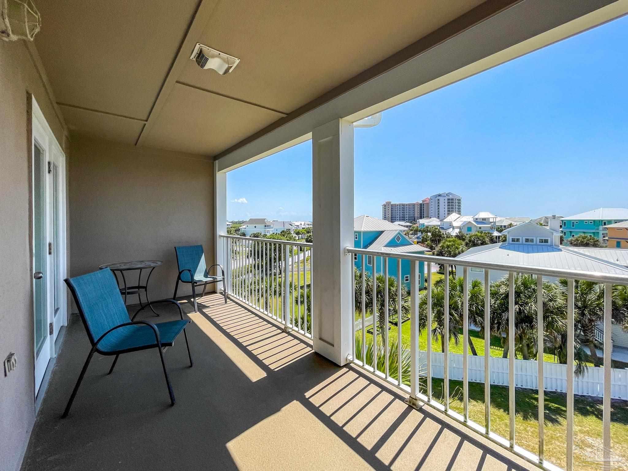13351 Johnson Beach Road, Unit 402E Pensacola, FL 32507 - Photo 30 of 30 a view of a balcony with furniture