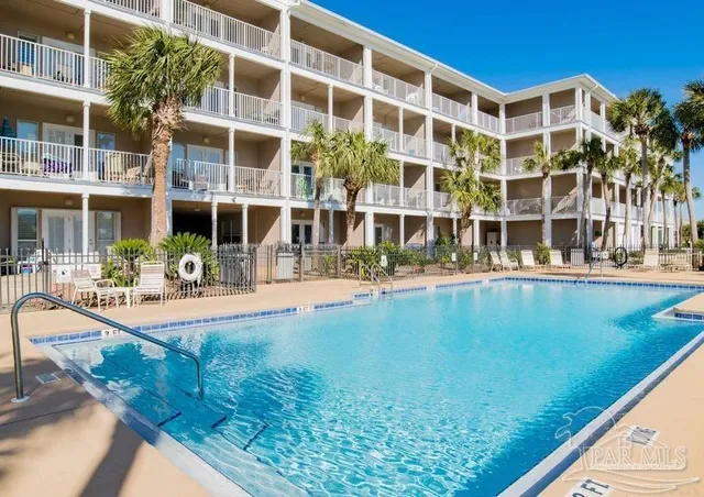 front view of building with a swimming pool