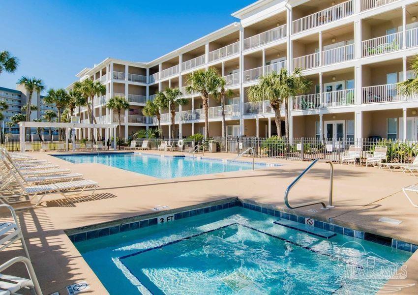 13351 Johnson Beach Road, Unit 402E Pensacola, FL 32507 - Photo 7 of 30 a swimming pool view with a outdoor space