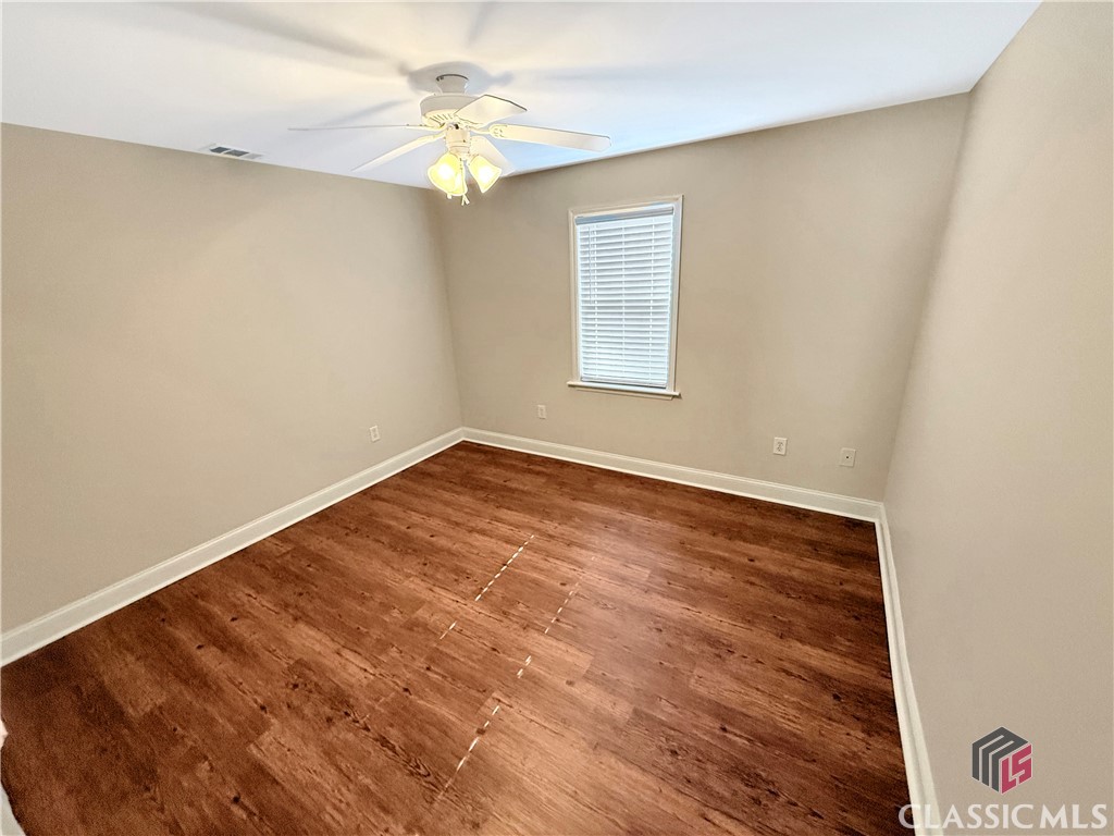 445 Logmont Trace, Unit 17 Athens, GA 30606 - Photo 12 of 28 Main level Bedroom #1 with LVT