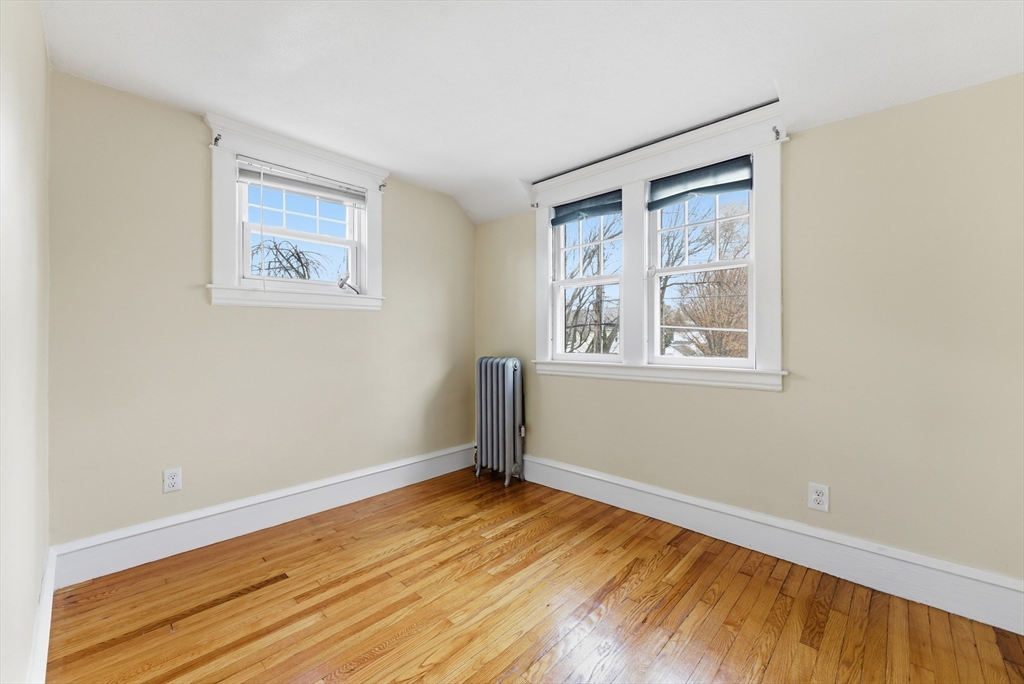 36 Garland Street Springfield, MA 01118 - Photo 31 of 42 a view of a room with wooden floor and window