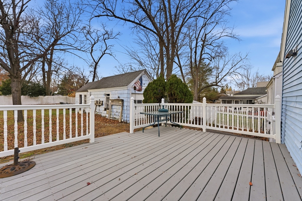 36 Garland Street Springfield, MA 01118 - Photo 35 of 42 a view of deck with wooden floor and fence