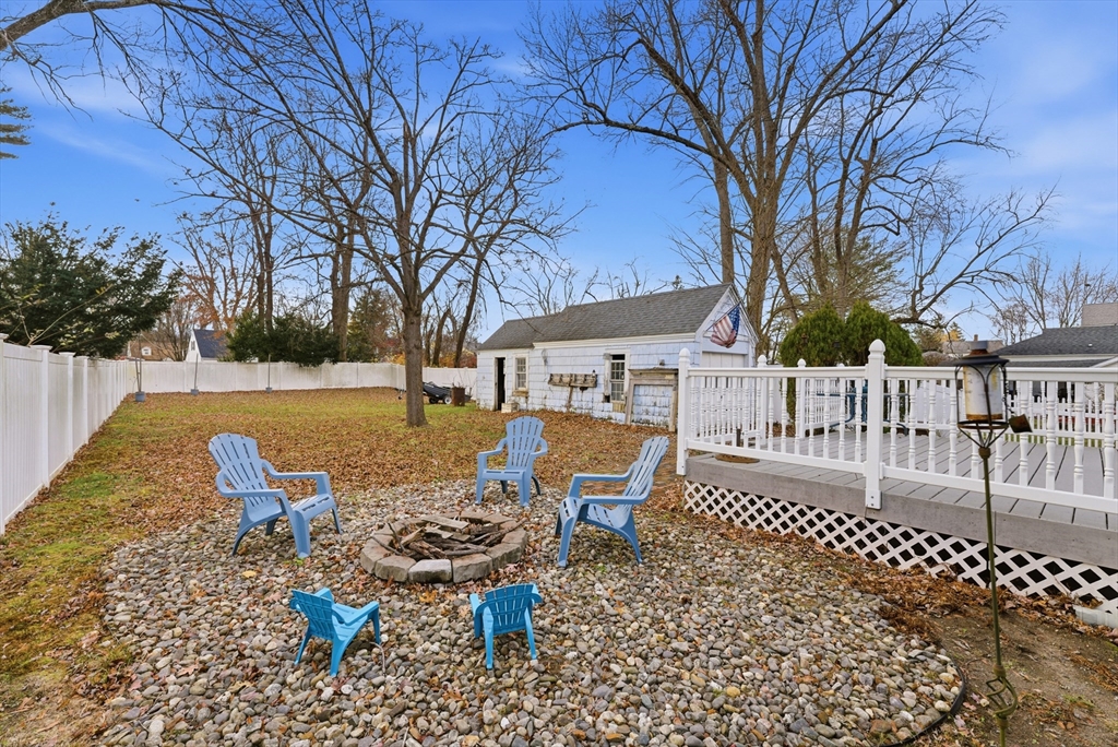 36 Garland Street Springfield, MA 01118 - Photo 37 of 42 a view of a wooden dinning table and chairs in patio