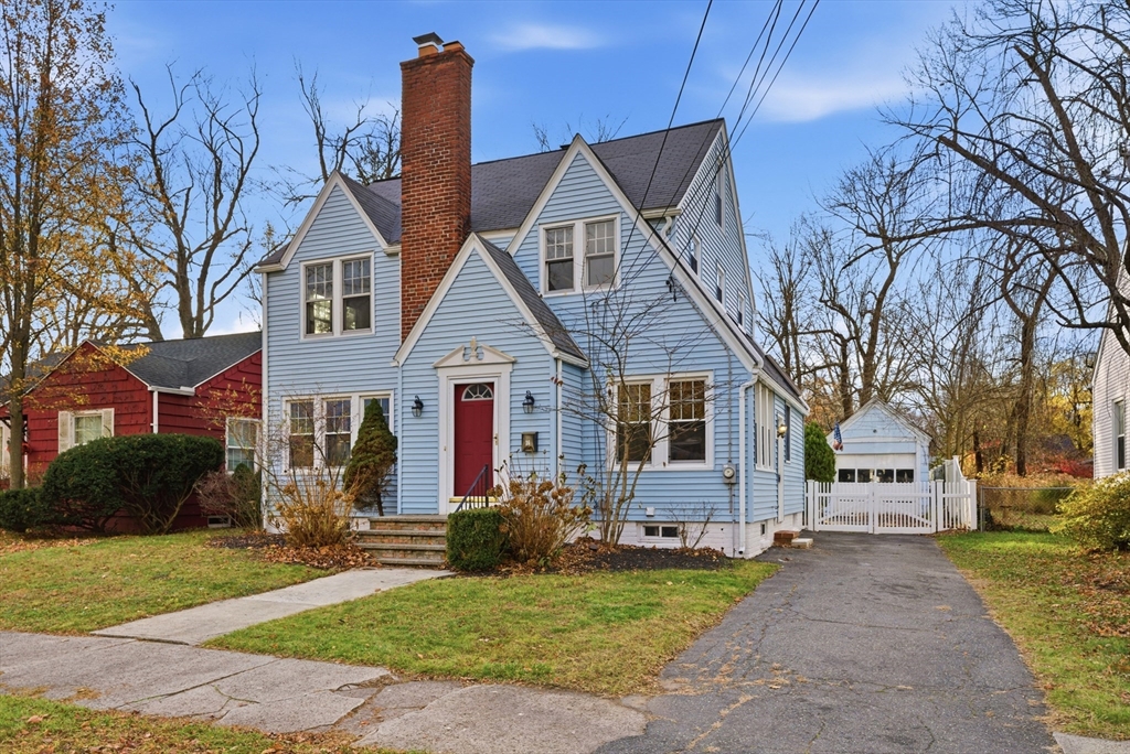 36 Garland Street Springfield, MA 01118 - Photo 40 of 42 a front view of a house with a yard and garage