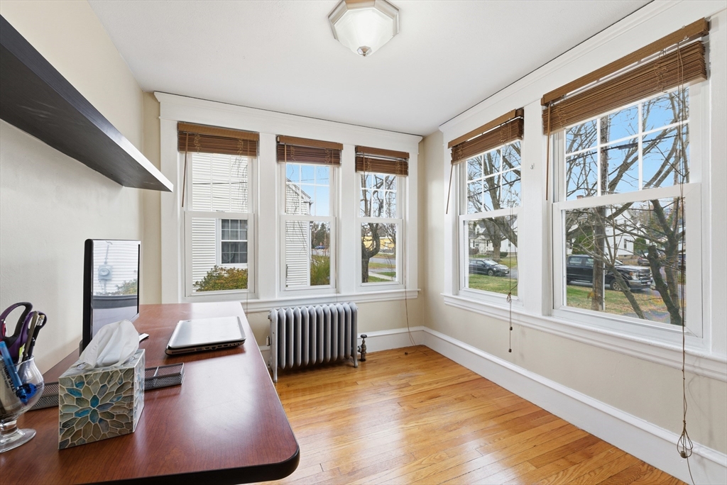 36 Garland Street Springfield, MA 01118 - Photo 8 of 42 a living room with furniture and a large window