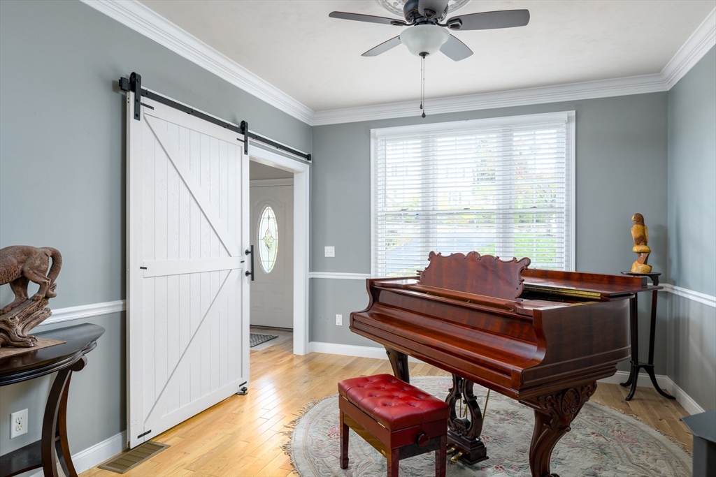 40 Rustic Drive Worcester, MA 01609 - Photo 11 of 37 a living room with furniture a ceiling fan and a window