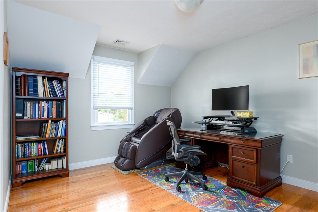 40 Rustic Drive Worcester, MA 01609 - Photo 23 of 37 a view of a workspace with furniture and a bookshelf
