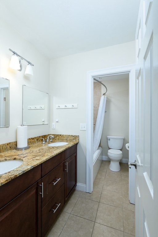 40 Rustic Drive Worcester, MA 01609 - Photo 25 of 37 a spacious bathroom with a granite countertop sink and a mirror