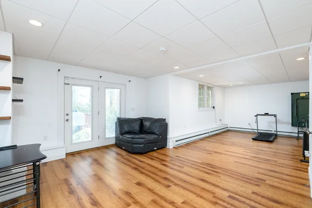 a view of balcony with wooden floor and outdoor seating