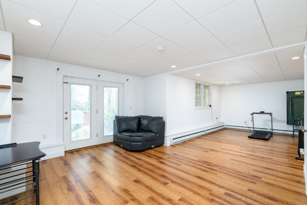40 Rustic Drive Worcester, MA 01609 - Photo 27 of 37 a living room with furniture and a wooden floor