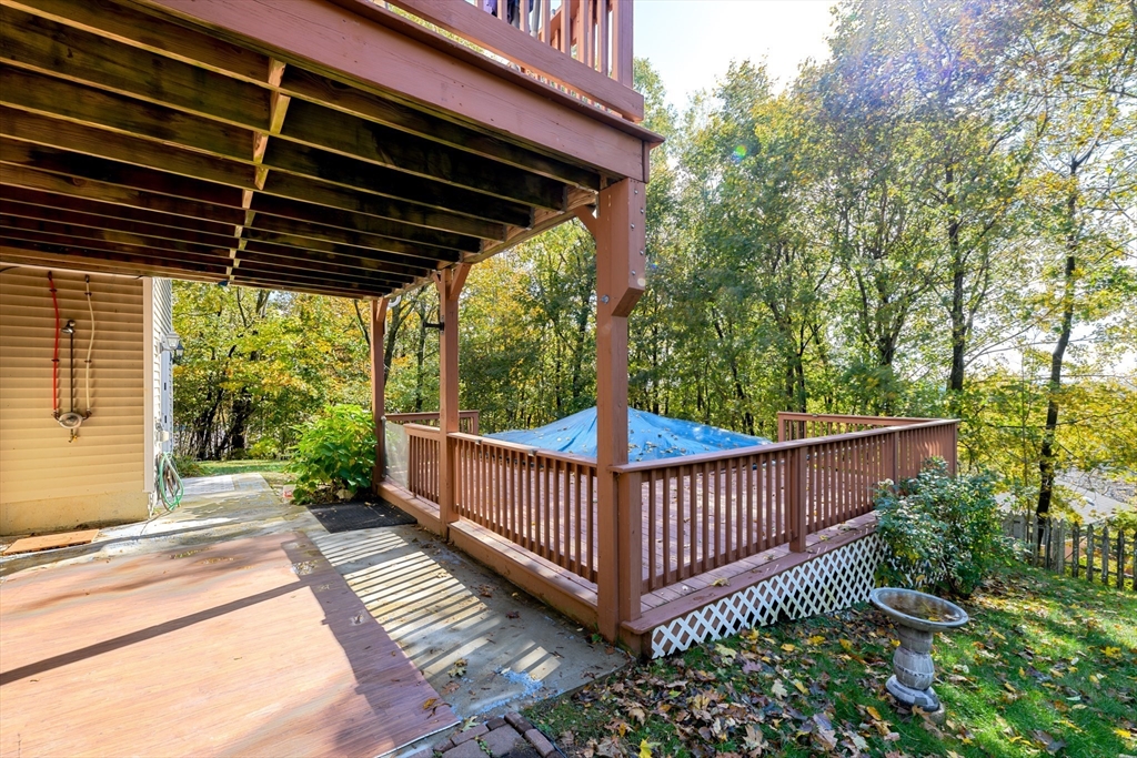 40 Rustic Drive Worcester, MA 01609 - Photo 31 of 37 a view of a roof deck with wooden fence and wooden floor