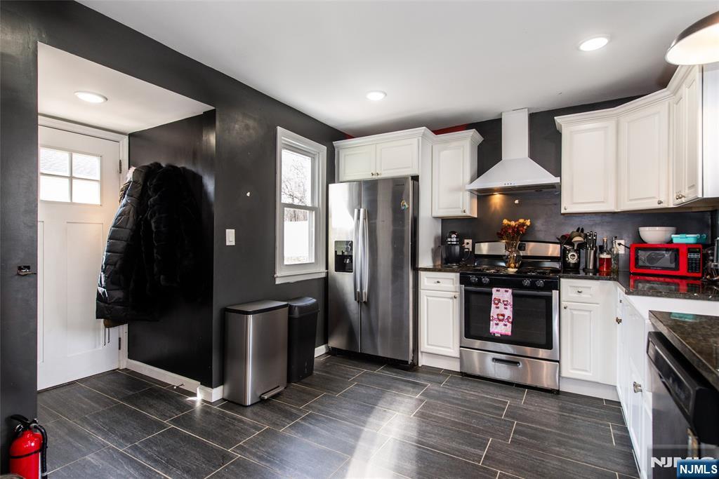 405 Washington Street Boonton, NJ 07005 - Photo 11 of 24 a kitchen with stainless steel appliances granite countertop a refrigerator and a stove