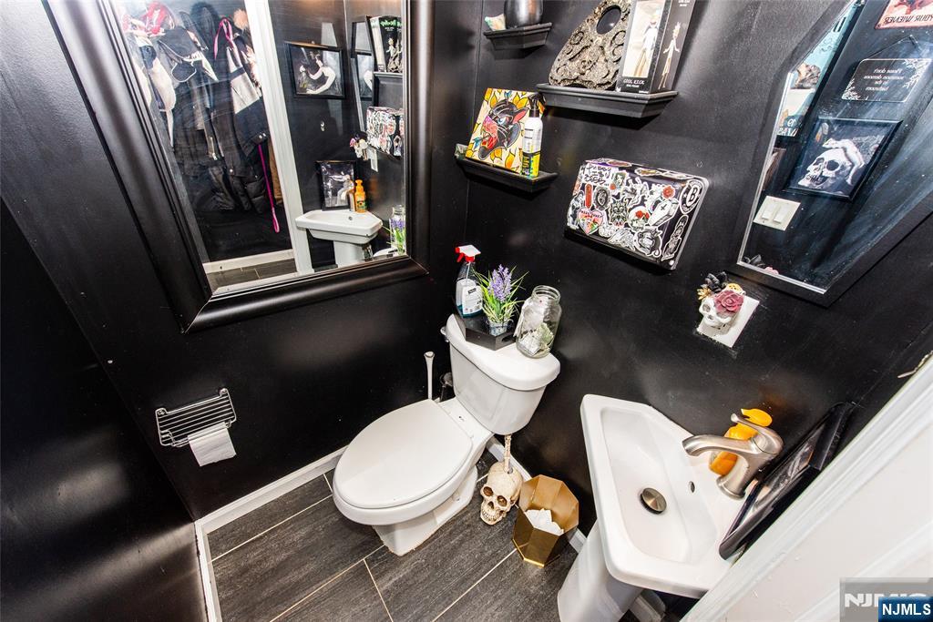405 Washington Street Boonton, NJ 07005 - Photo 12 of 24 a bathroom with a toilet sink and mirror