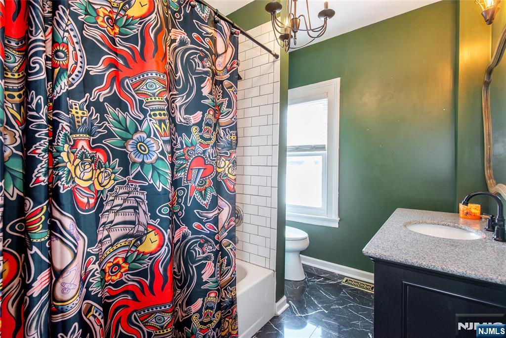 405 Washington Street Boonton, NJ 07005 - Photo 14 of 24 a bathroom with a sink and a mirror