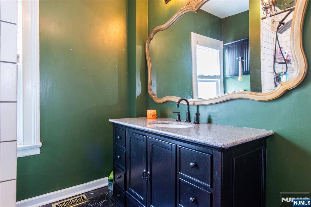405 Washington Street Boonton, NJ 07005 - Photo 15 of 24 a bathroom with a sink and a mirror