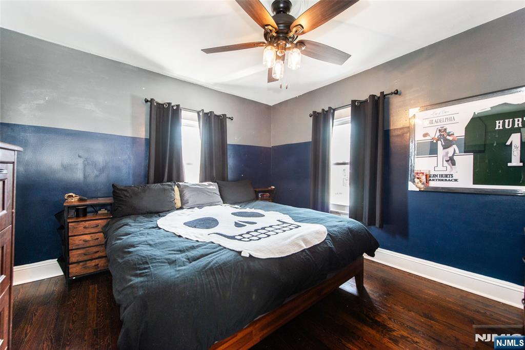 405 Washington Street Boonton, NJ 07005 - Photo 16 of 24 a bedroom with a bed and a chandelier