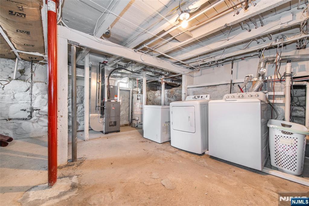 405 Washington Street Boonton, NJ 07005 - Photo 18 of 24 a view of a storage & utility room with dryer and washer