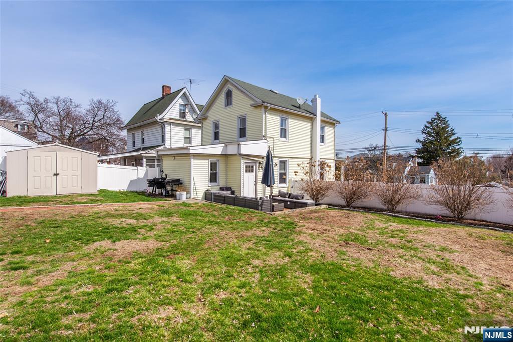 405 Washington Street Boonton, NJ 07005 - Photo 20 of 24 a view of a house with a big yard and large trees