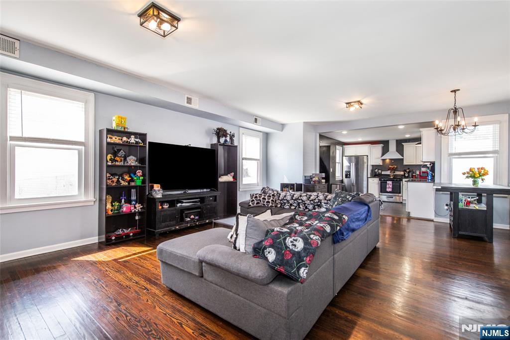 405 Washington Street Boonton, NJ 07005 - Photo 4 of 24 a living room with furniture and a flat screen tv