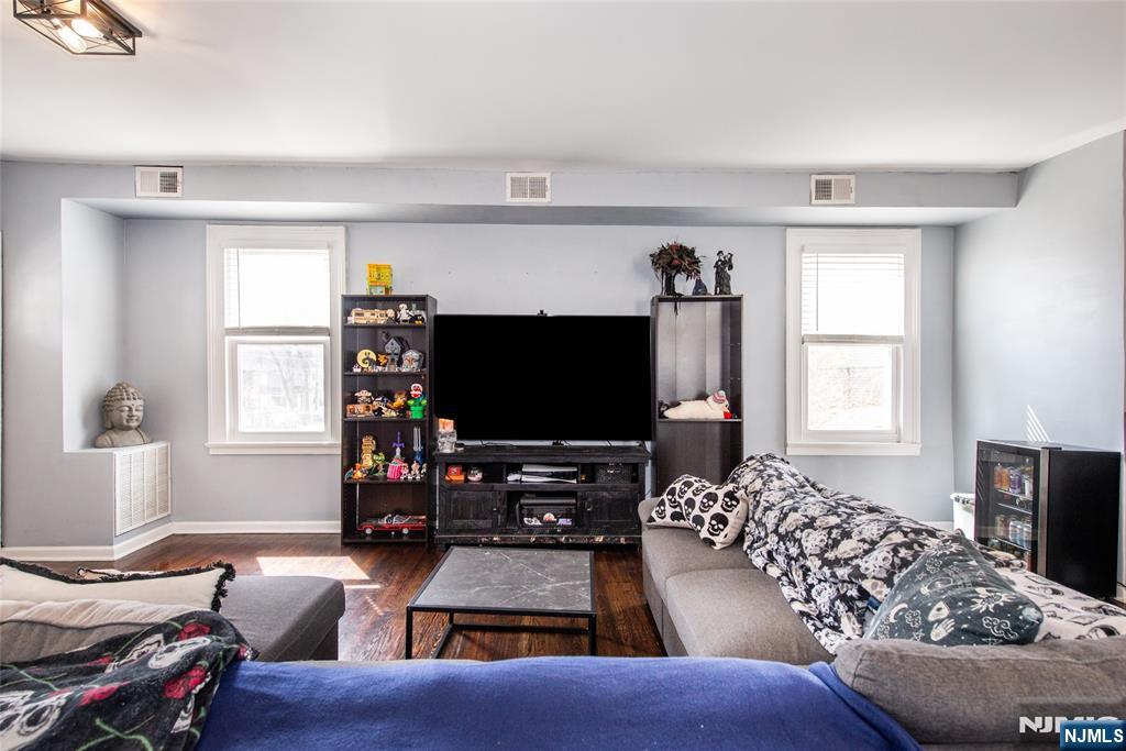 405 Washington Street Boonton, NJ 07005 - Photo 5 of 24 a living room with furniture and a flat screen tv