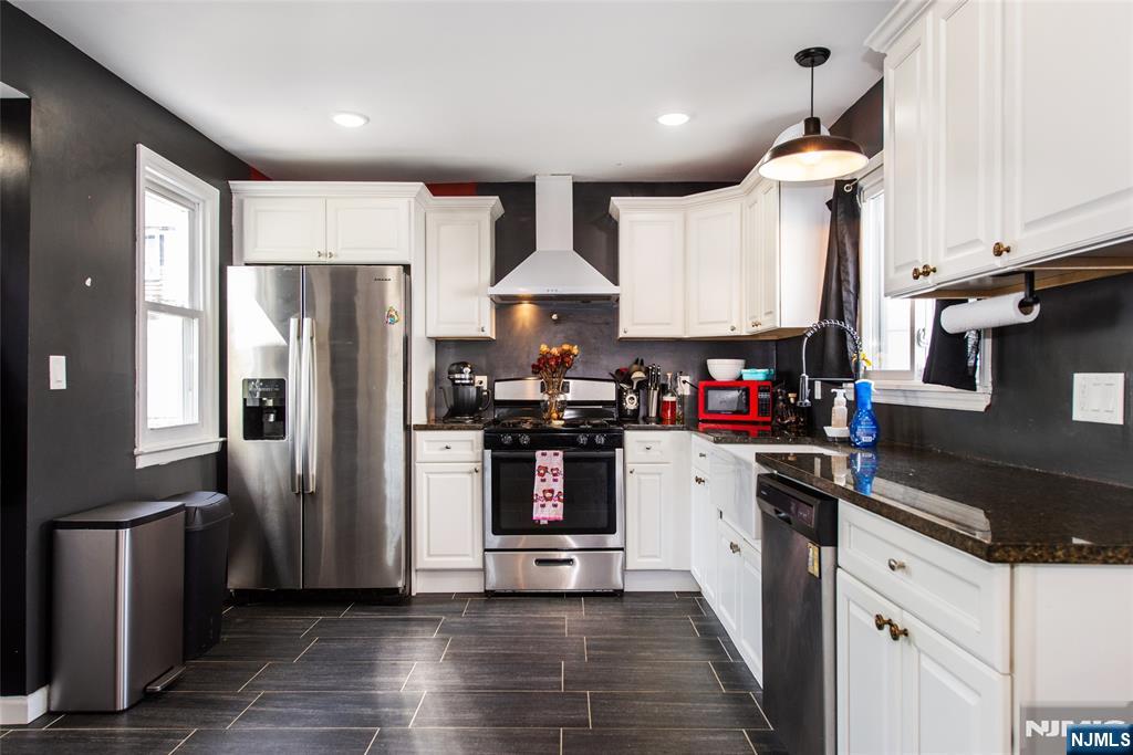 405 Washington Street Boonton, NJ 07005 - Photo 8 of 24 a kitchen with stainless steel appliances granite countertop a refrigerator stove and sink